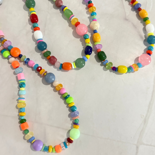 Colorful beaded necklace on a light background