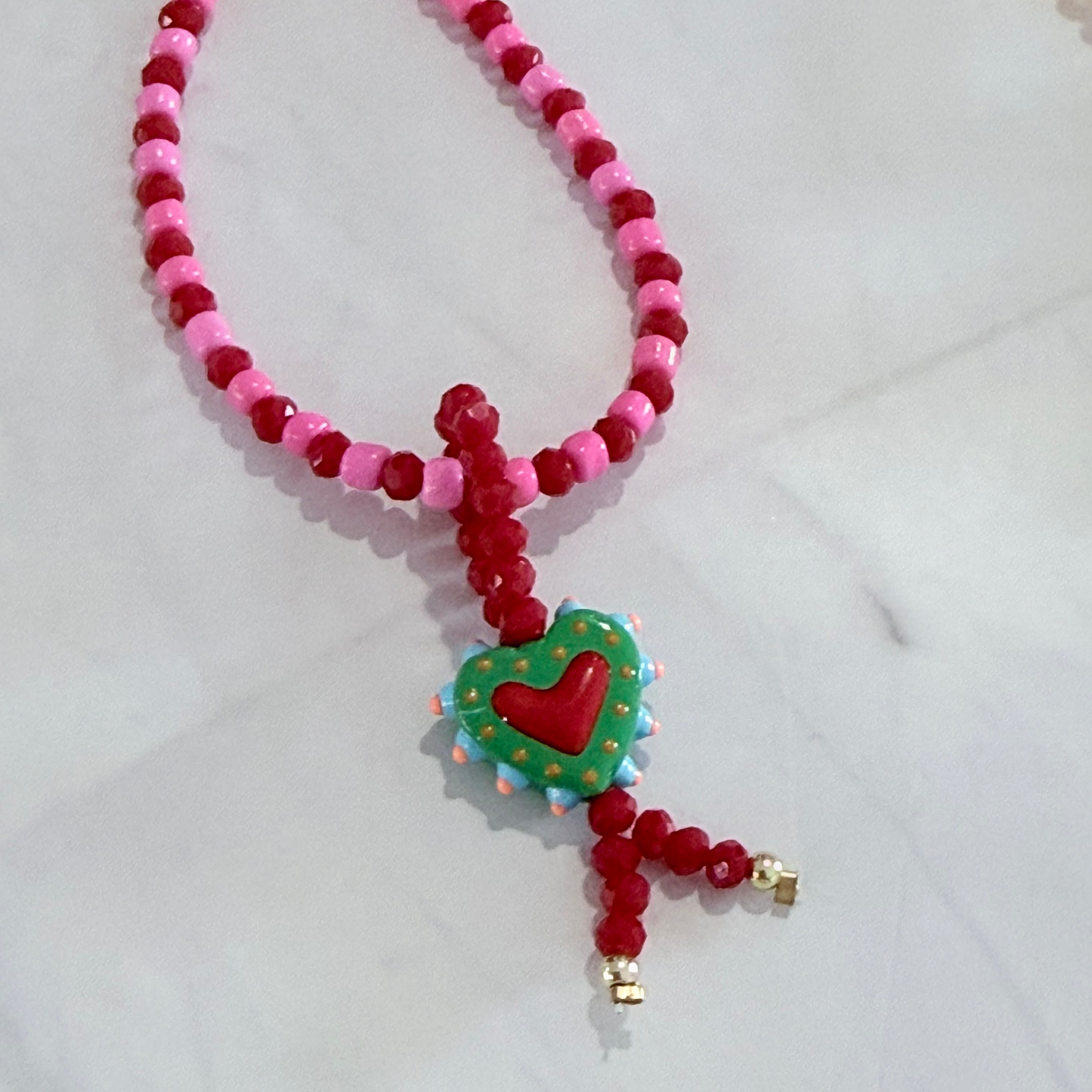 Necklace with heart-shaped pendant on a white background
